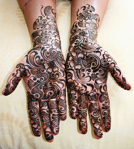 The Mehndi (known as Henna) is a temporary tattoo that the bride, family, 